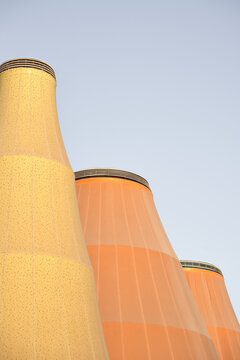 Industrial cooling towers against blue sky