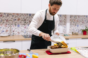 Cook dinner. Christmas time. Kitchen interior. Baking tray. Tasty meal