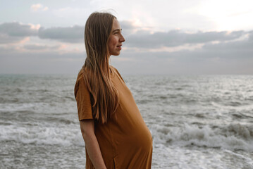 Pregnant woman at the seaside