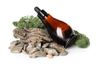 Cosmetic dropper bottle with green moss, tree bark and rocks on white background