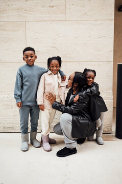 Family in fall fashion holding hands walking  in shopping center