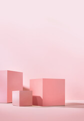 Set of three pink podiums for presentation cosmetics products.