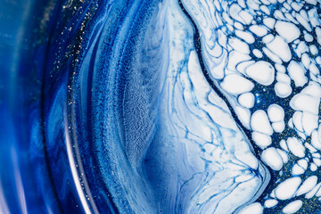 Abstract blue background with speckles of gold