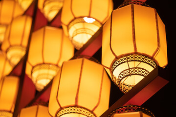Yellow illuminated Chinese lanterns low angle view at night for the Chinese new year - 564856577