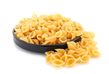 Plate of raw conchiglioni pasta isolated on white background