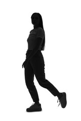Silhouette of young woman walking on white background