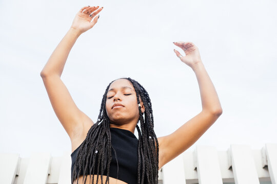 self-confident and expressive woman with long braids