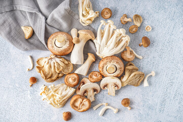 Heap of fresh mushrooms on light background
