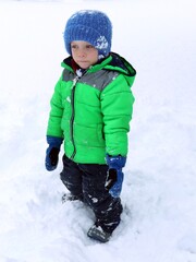 child standing in snow