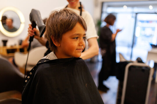 Happy boy at hairdresser