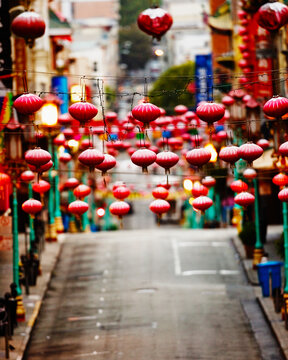 Red lanterns hang over Grant Avenue.