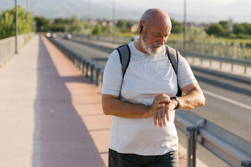 Boomer Checking His Pulse On A Smartwatch