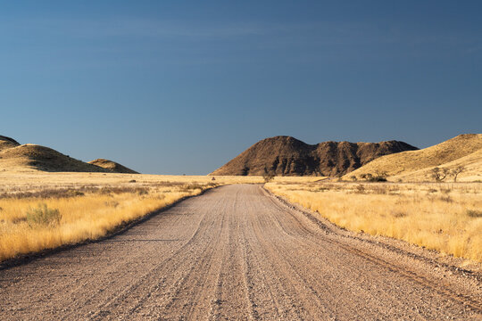 Dirt Road Between Hills On Namib Desert in Namibia