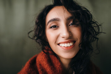 Closeup happy woman portrait with curly hair