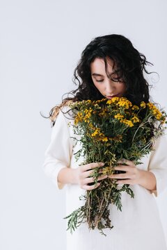 Woman smell flowers