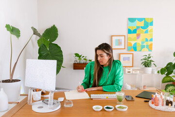 Natural cosmetics biologist working in her office