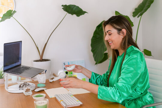 Naturopathic businesswoman in her 40s working at cozy office - Powered by Adobe