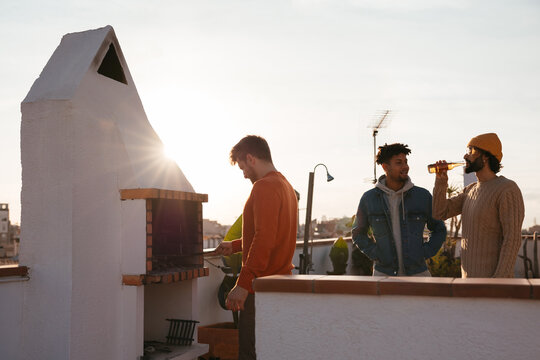 Happy friends spending time together in a rooftop