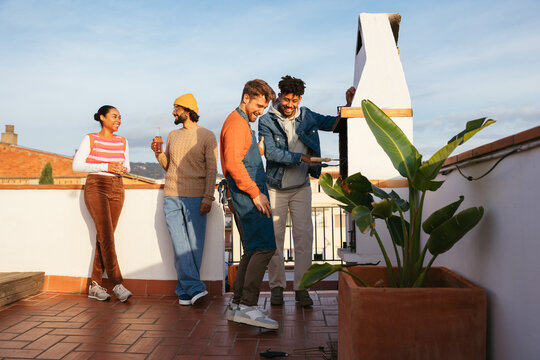 Happy friends spending time together in a rooftop