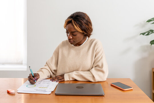 Woman paying the bills from home