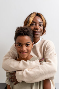 Mother hugging son