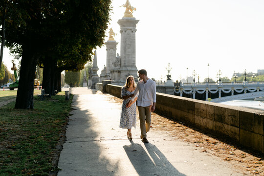 young couple by bridge in Paris 