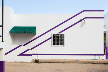 Minimalist white building with purple diagonal lines