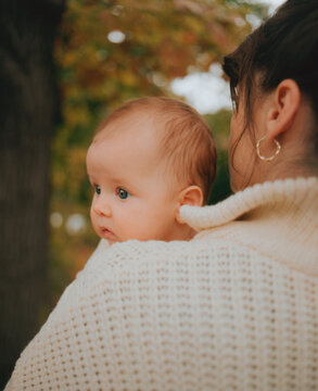 baby girl in mother arms