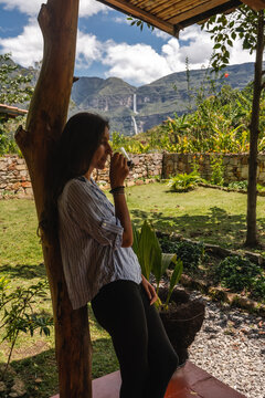 woman enjoying a cup of coffee outdoors