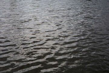 The surface of the water is slightly wavy when it is dark.
