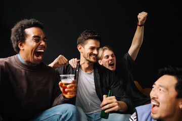 Young Men Watching Match at Home