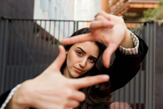 Woman Portrait with Creative Hand Gesture