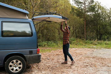 Man closing the trunk of his van