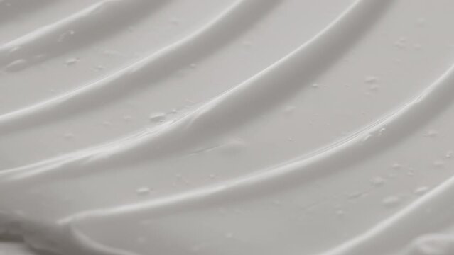Side view macro texture of white eye cream with shea butter | Eye cream commercial