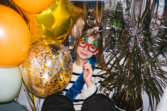 A girl is photographed at a New Year's party.