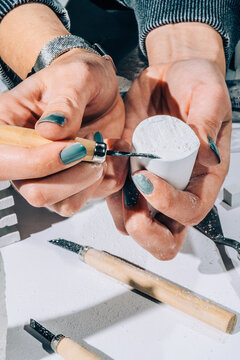 Art Conservator cleaning artifacts