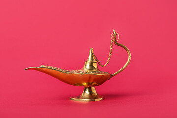 Fototapeta na wymiar Aladdin lamp of wishes for Ramadan on red background