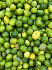 Organic limes at a market stand
