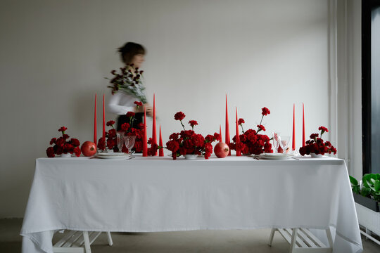 Placesettings and Christmas decorations on dining table
