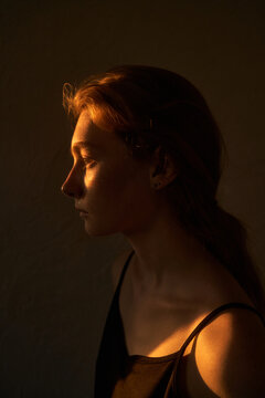 Female illuminated with morning sunlight