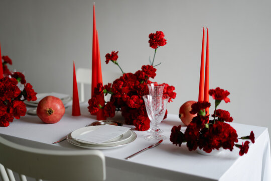 New year table setting with red dianthus