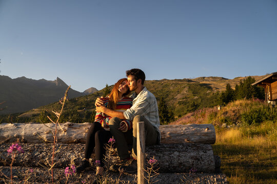 Loving Couple in the mountain at sunset