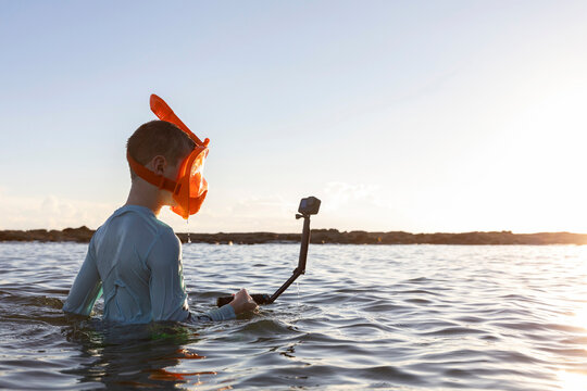 Boy Snorkeling waterproof camera in Costa Rica making selfie video