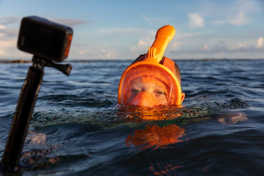 Boy Snorkeling camera portrait  in Costa Rica making selfie video