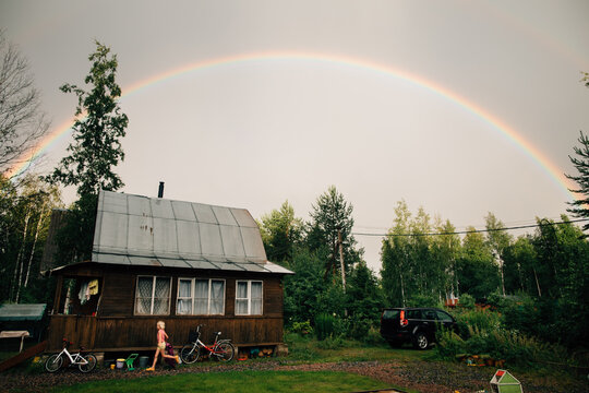 Rainbow under the rural house