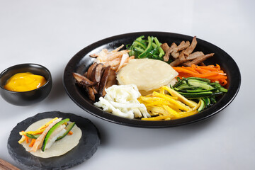 Gujeolpan or Platter of Nine Delicacies is a Beautiful and Nutritionally Well Balanced Dish, Served on Korean Traditional Holidays such as Lunar New Year and Other Special Occasians. 