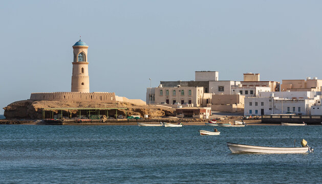 View of the Al Ayjah town and a watchtower from the Khor Al Batah bridge in Sur, Oman