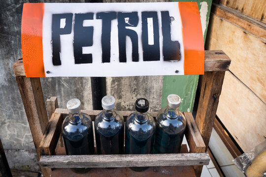 Petrol (Gas) for sale in glass bottles on the side of the road in Bali
