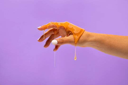 Hand dripping pure honey