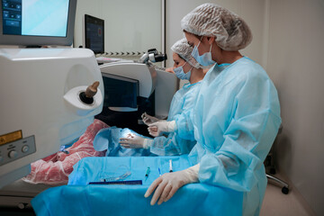 The surgeon performs an eye operation